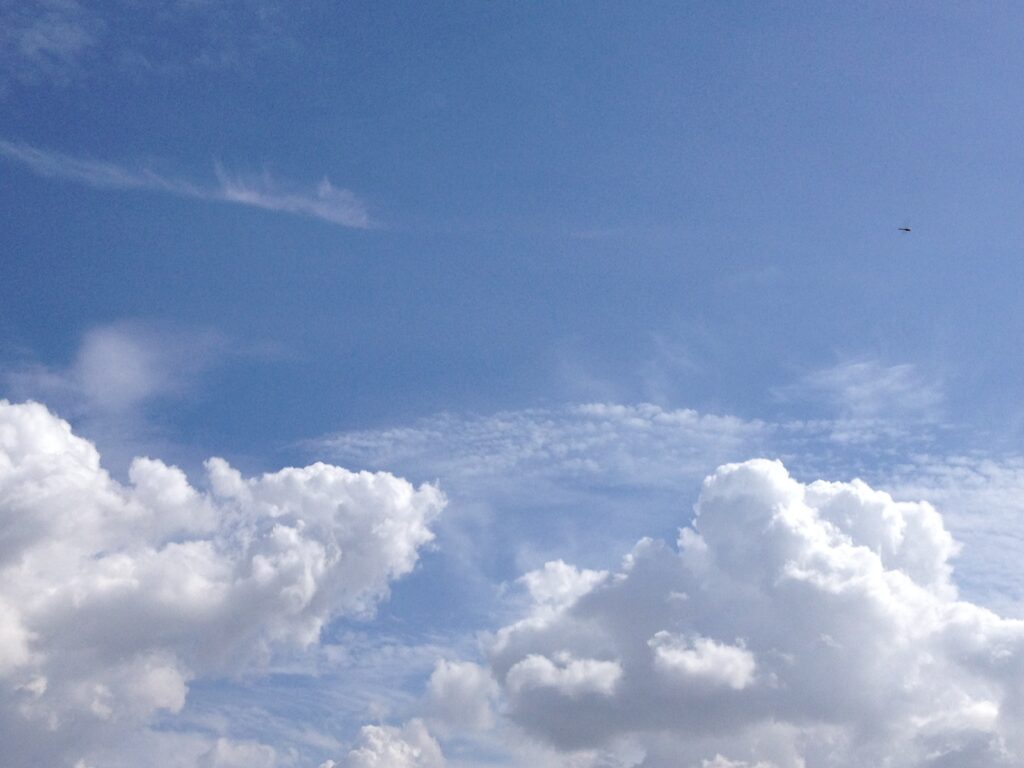 Blue sky with fluffy white cumulus clouds